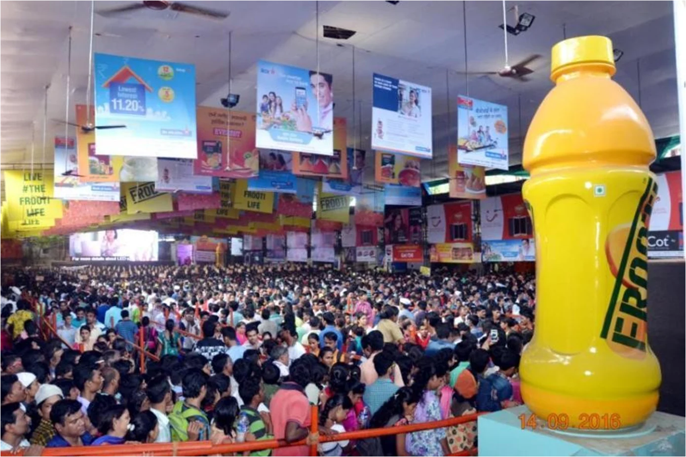 Large crowd at Ganesh pandal in Hyderabad with ERO cooler and banner branding