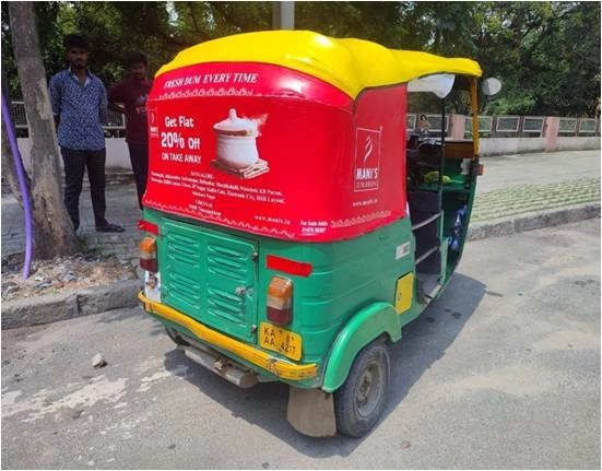 Auto rickshaw branding example with rear hood advertisement